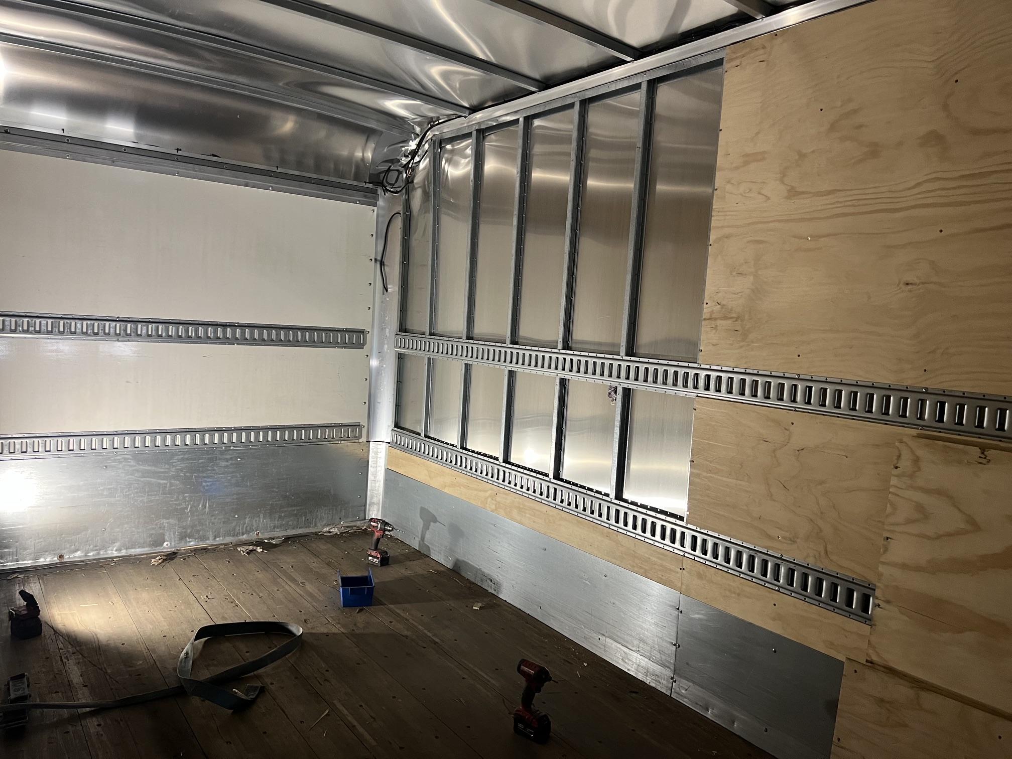 Box truck interior rebuild — bare metal walls, fresh plywood lining